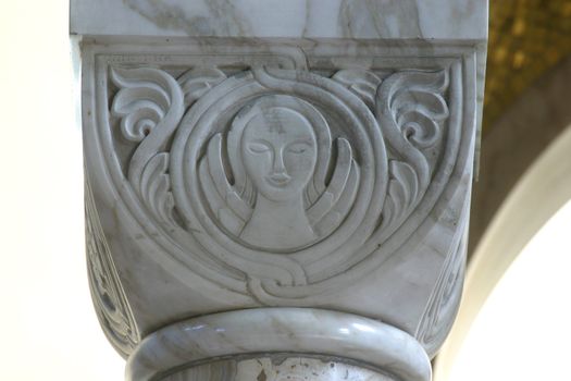 Symbol of Saint Matthew, historic church column ornate detail