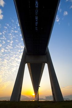 Tsing Ma Bridge landmark in Hong Kong under sunset