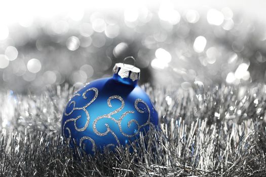 blue christmas ball on silver background