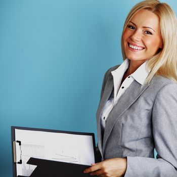  business woman hold a folder of papers on a blue background