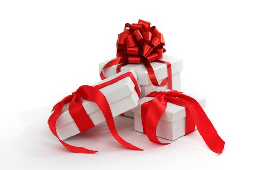 white gift with red ribbon