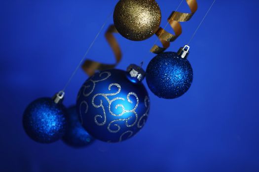 christmas balls on blue satin background