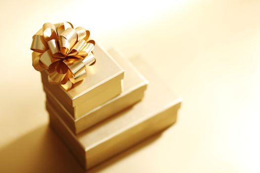 golden christmas gifts on gold background 