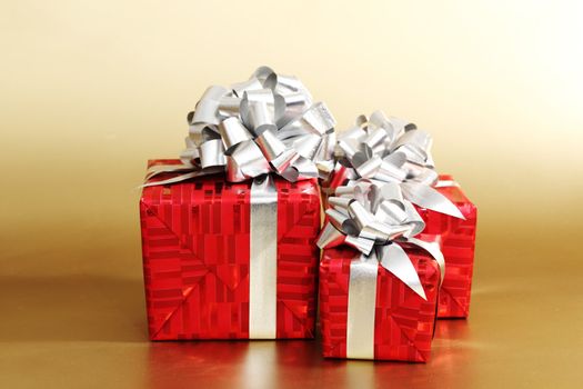 golden christmas gifts on gold background 