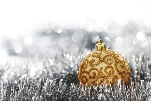  golden christmas ball on silver background