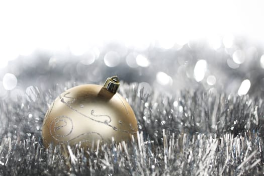  golden christmas ball on silver background