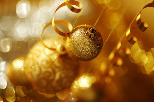 golden christmas balls on bokeh background