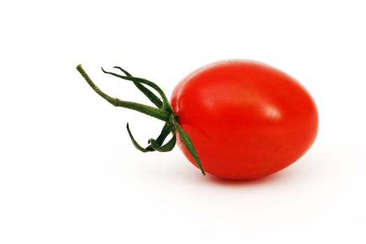 one cherry tomato isolated on white