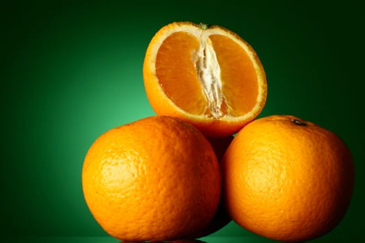 oranges isolated on green background