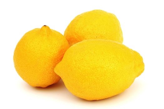 yellow lemons pile isolated on white