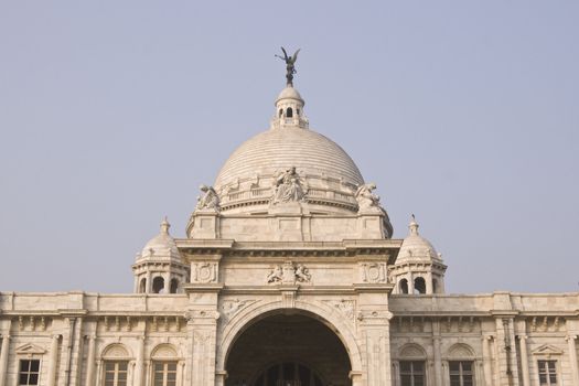 Victoria Memorial in Kolkata, India. Ornate white marble building, originally constructed as a monument to Queen Victoria of Great Britain, now a museum.