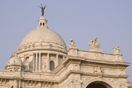 Victoria Memorial in Kolkata, India. Ornate white marble building, originally constructed as a monument to Queen Victoria of Great Britain, now a museum.