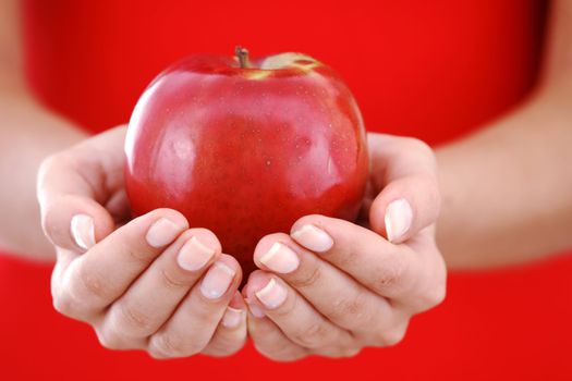 red apple in hand close up