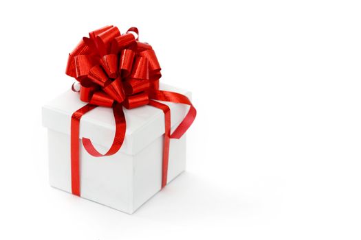 white christmas gift with red ribbon