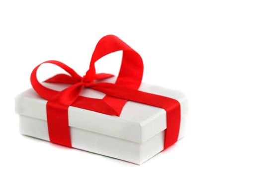  white christmas gift with red heart ribbon