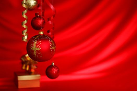  christmas balls on red satin background