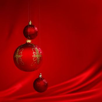  christmas balls on red satin background