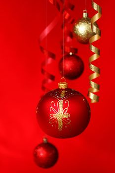  christmas balls on red satin background