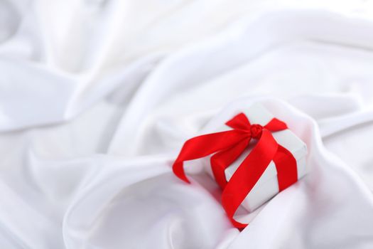  christmas gift on white silk background