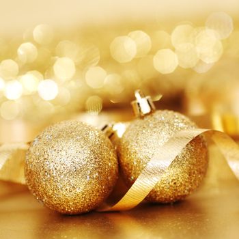 golden christmas ball on golden bokeh background