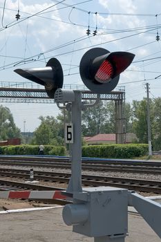 Summer. The railway. A semaphore. A red signal.