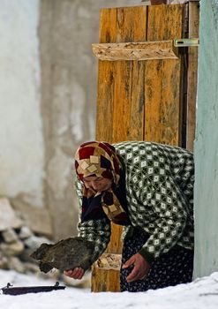 January 2008 Ankara Turkey - traditional Turkish woman near here house