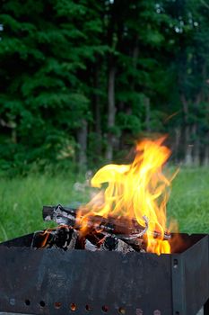 small road mangal with the burning firewood