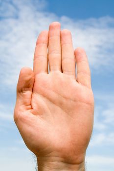 oath. hand gesture with blue sky at background