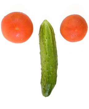 Abstract face. Green nose. Red eyes. fresh cucumber and tomatoes on a white background