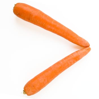 angle. fresh orange carrot on a white background