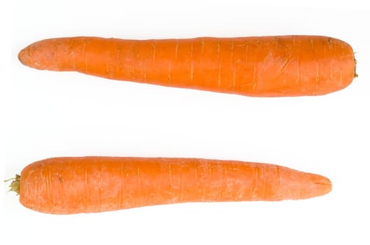 equal sign. fresh orange carrot on a white background
