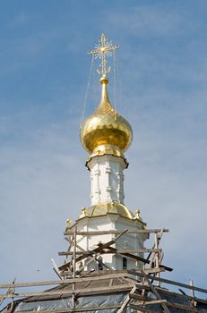 the cupolas of orthodox temple with sky at background