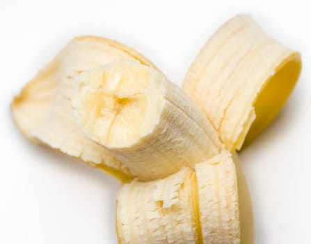 The taken a bite banana on a white background