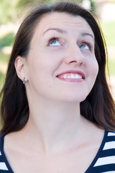 portrait. smile. young woman look up