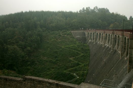 Dam in near Robertville village – gloomy day in Ardennes Mountain – Belgium.