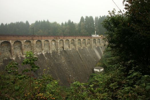 Dam in near Robertville village – gloomy day in Ardennes Mountain – Belgium.