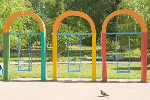Multi-coloured swing in city park