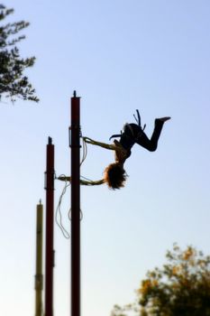 Bungee jumping girl with a blue sky