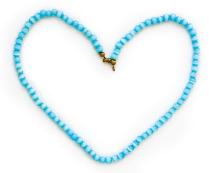 This is a blue bead necklace in the shape of a heart.