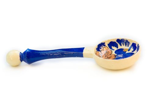 The small wooden spoon with old russian patterns.