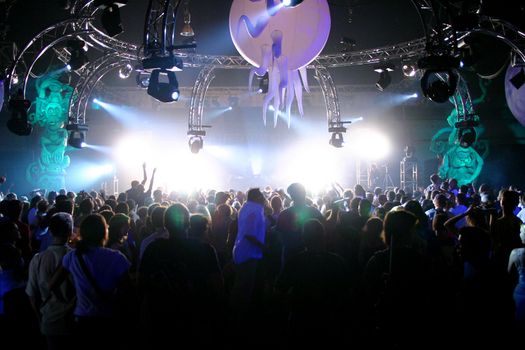 People jumping and dancing during a live concert