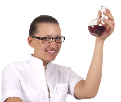 young woman scientist  chemist mixes the liquid in the tubes