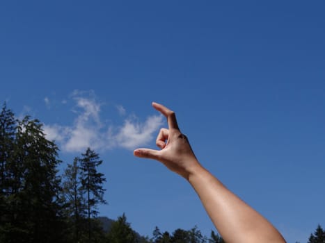 Catching clouds with hand