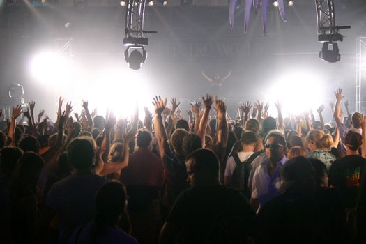 People jumping and dancing during a live concert
