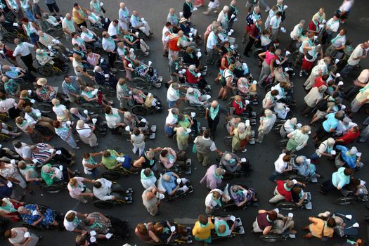 Group of people during a ceremony in Lourdes, France 