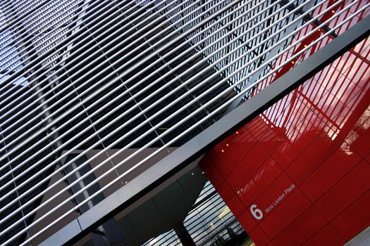 Red and low angle entrance of entrance to a corporate building in London