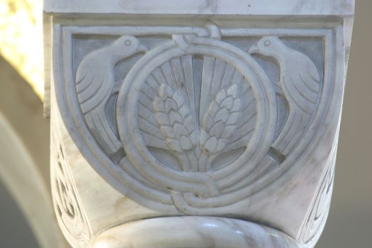 Symbol of the Eucharist, historic church column ornate detail