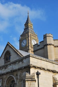 Westminster tower with building in foreground