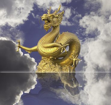 golden chinese dragon statue on blue sky background