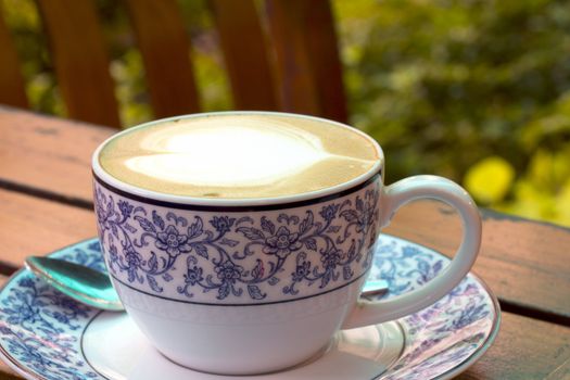 Coffee cup on the woodden table.
